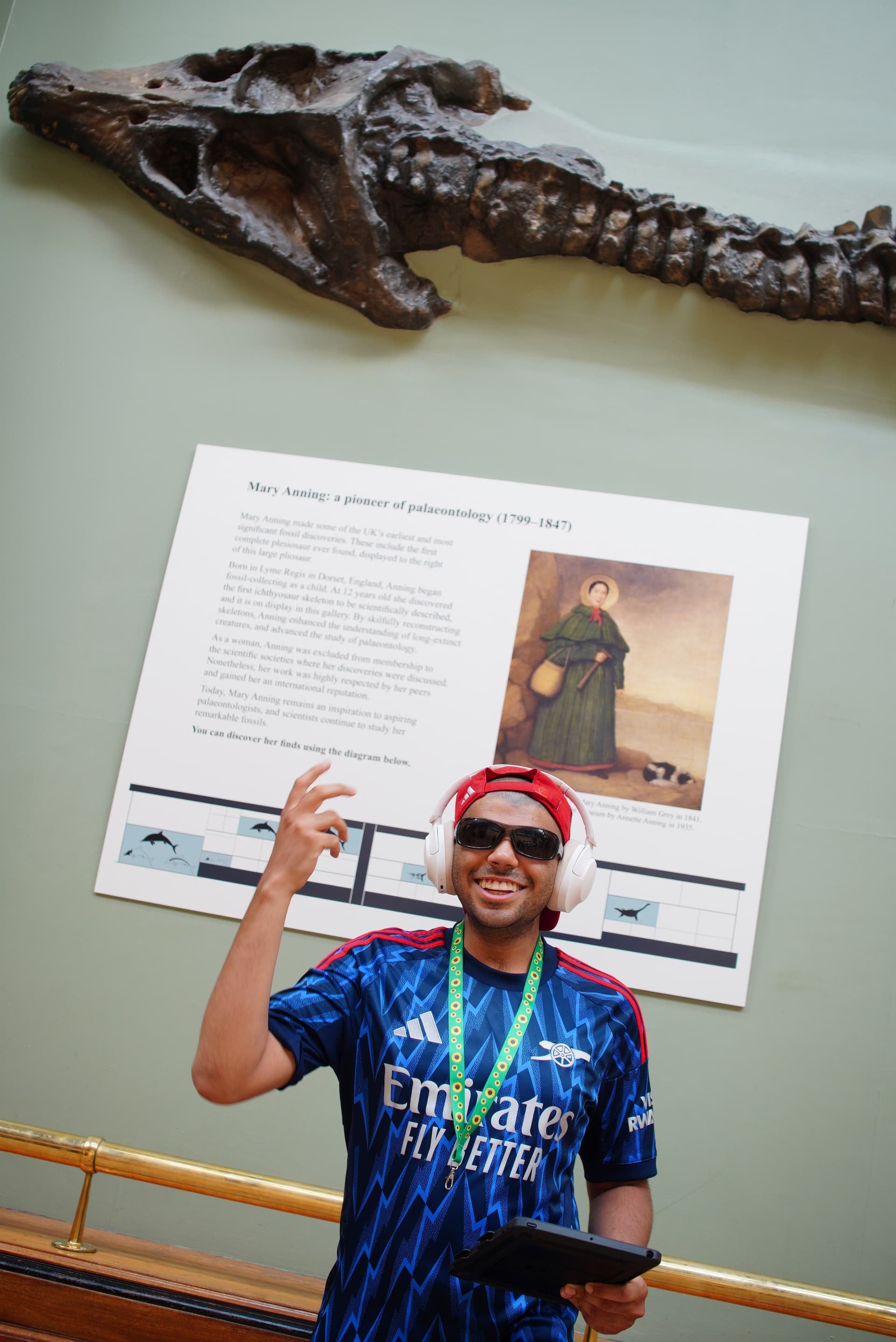 Danyal next to a fossil display at the Natural History Museum